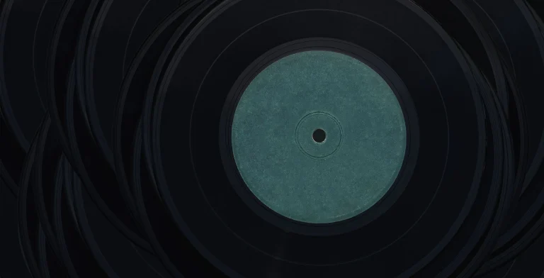 A close-up view of vintage vinyl records with blank center labels, perfect for music lovers — an editorial image for "The Album Cover as Art: Design, Symbolism, and the Visual Language of Music."