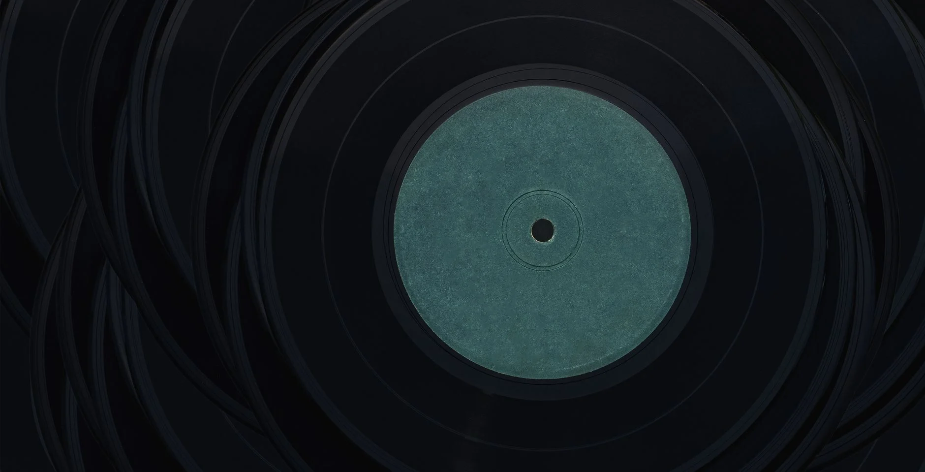 A close-up view of vintage vinyl records with blank center labels, perfect for music lovers — an editorial image for "The Album Cover as Art: Design, Symbolism, and the Visual Language of Music."