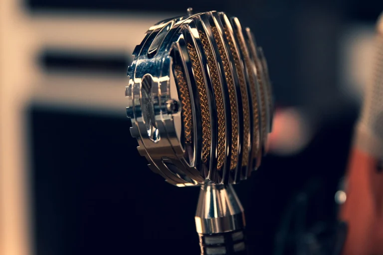 Close-up of a vintage condenser microphone in a recording studio with a focus on intricate details — an editorial image for "Aretha Franklin: Voice, Interpretation, and Musical Legacy."