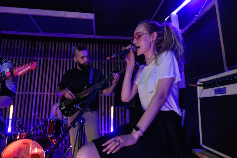 Dynamic live performance of a band with vibrant lighting and engaging musicians — an editorial image for "The Beatles and Their Transformation of Popular Music."