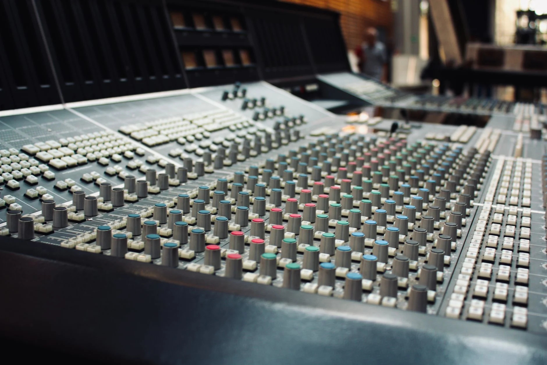 Close-up of a professional audio mixing console in a recording studio in Ciudad de México, Mexico — an editorial image for "Billie Jean: Rhythm, Production, and Pop Culture."