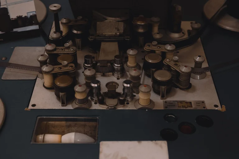 Closeup view of vintage film editing equipment, showcasing knobs and reels, perfect for retro film themes — an editorial image for "The Birth of the Music Documentary and Concert Film."