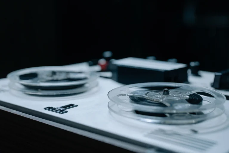 Detailed view of a vintage reel-to-reel tape recorder showcasing classic design and equipment — an editorial image for "Imagine and the Sound of Post-Beatles Idealism."