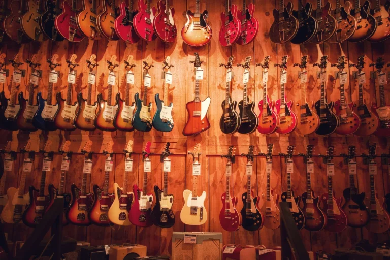 Vibrant display of various electric guitars hanging in a Los Angeles music store — an editorial image for "Nevermind and the Moment Alternative Rock Entered the Mainstream."