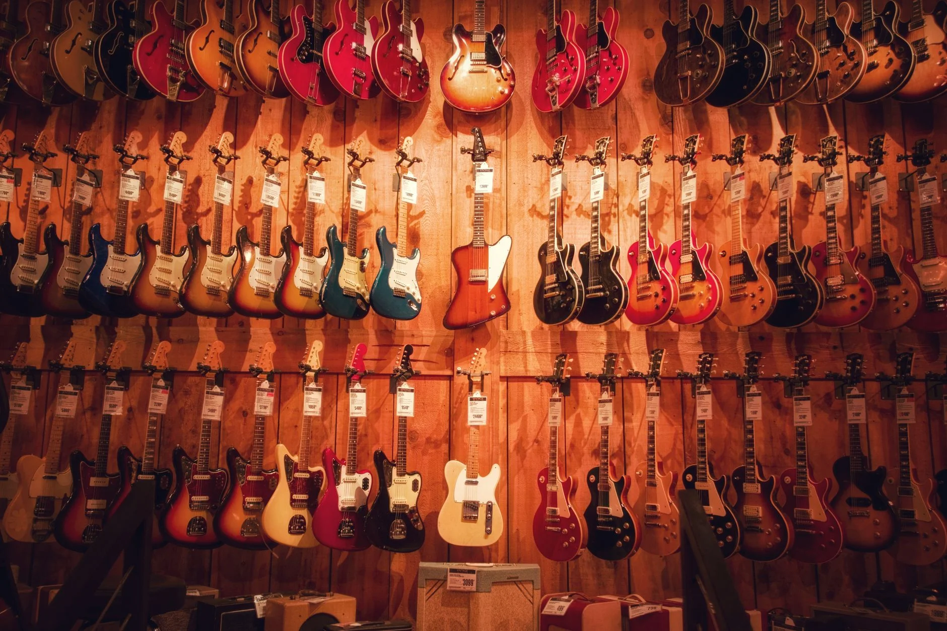 Vibrant display of various electric guitars hanging in a Los Angeles music store — an editorial image for "Nevermind and the Moment Alternative Rock Entered the Mainstream."