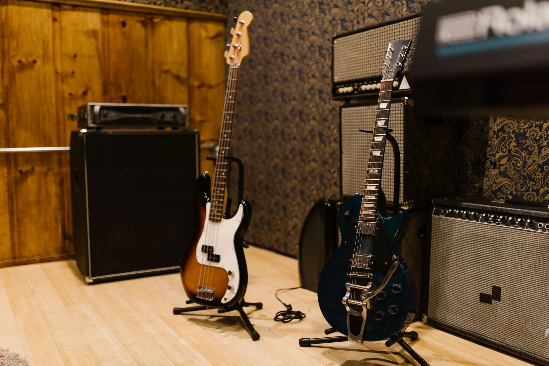 A cozy music studio featuring electric guitars and amplifiers, ideal for music production — an editorial image for "Prince: Musicianship, Independence, and Creative Control."