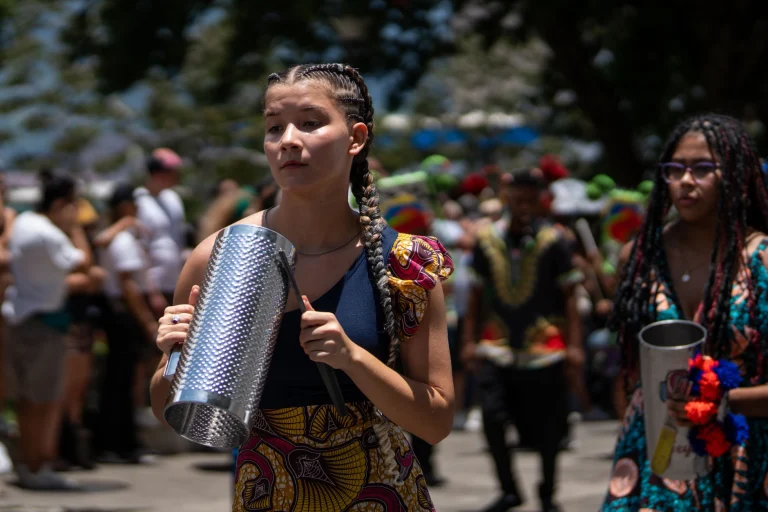 Vibrant festival celebration with musicians in traditional attire, San José, Costa Rica — an editorial image for "Reggae and the Globalization of Jamaican Music."