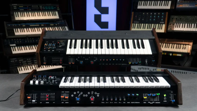 Classic vintage synthesizers in a professional music studio with multiple keyboards in the background — an editorial image for "Stevie Wonder: Innovation, Songwriting, and Sound."